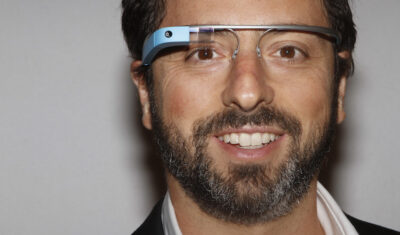 Google founder Sergey Brin poses for a portrait wearing Google Glass glasses before the Diane von Furstenberg Spring/Summer 2013 collection show during New York Fashion Week September 9, 2012. The show was used as a launching event for Google's new product "Glass by Google". REUTERS/Carlo Allegri (UNITED STATES - Tags: FASHION SCIENCE TECHNOLOGY BUSINESS TPX IMAGES OF THE DAY) - RTR37QZX